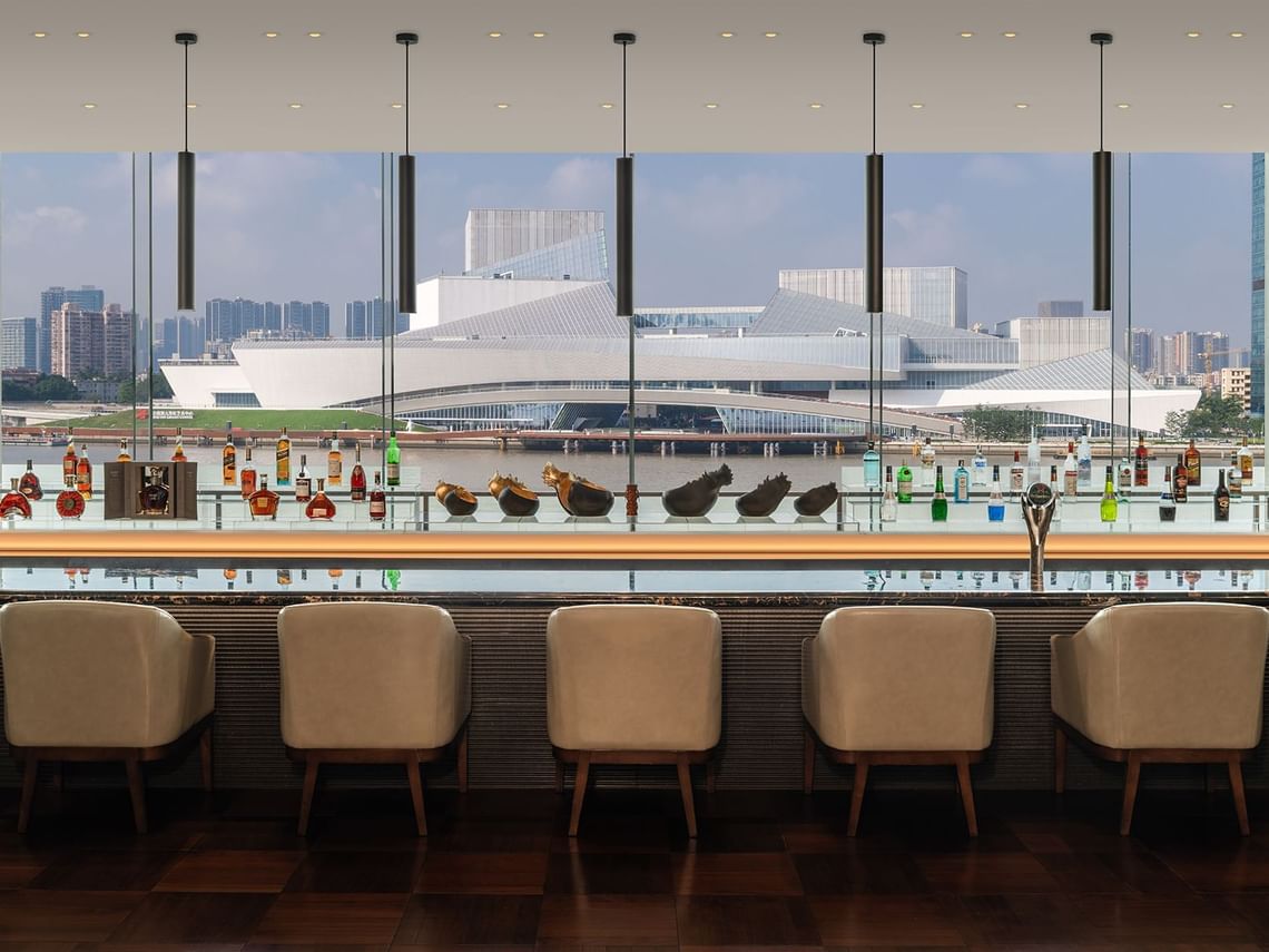 Project photograph of a hotel lounge overlooking the river.